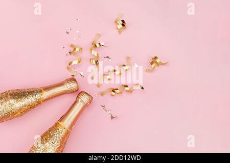 Sparkling wine, gold champagne bottle with glitter. Stock Photo