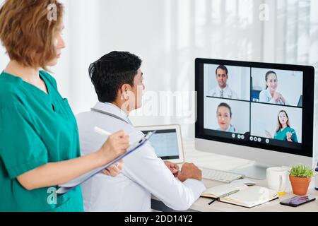 Chief physician having online conference Stock Photo