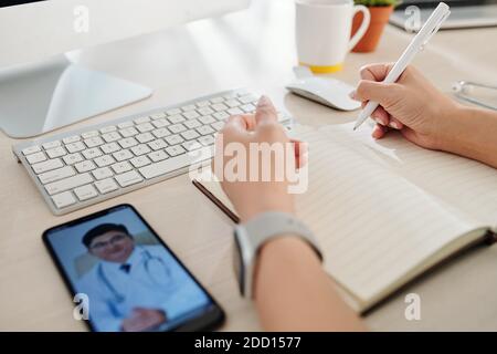 Doctor video calling colleague Stock Photo