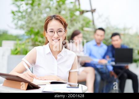 University student at cafe table Stock Photo