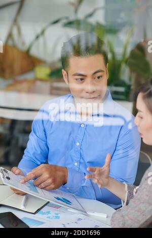 Entrepreneurs discussing report Stock Photo