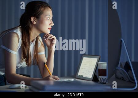 Female engineer working late Stock Photo