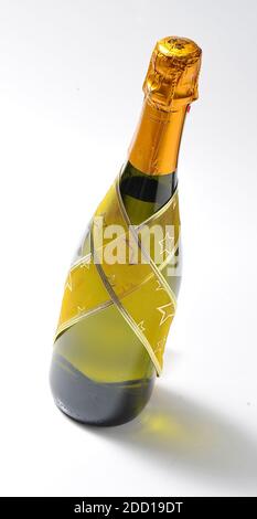 christmas bottle isolated on white background in its own gold-colored packaging Stock Photo