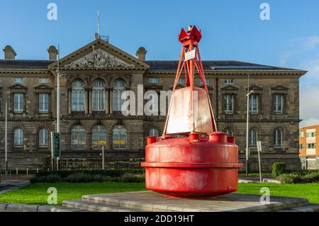 Large red buoy with Custom House in background, Donegall Quay, Belfast Stock Photo