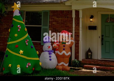 Christmas toy. New year decorations for house. Gingerbread and snowman on yard. Stock Photo