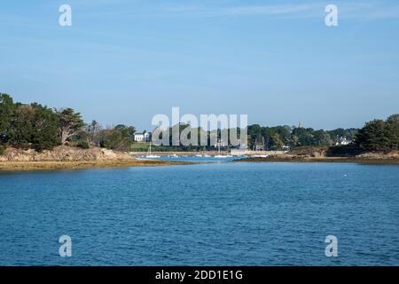 A chateau and boats moored at an island in The Golfe du Morbihan - Gulf of Morbihan - Brittany, France Stock Photo