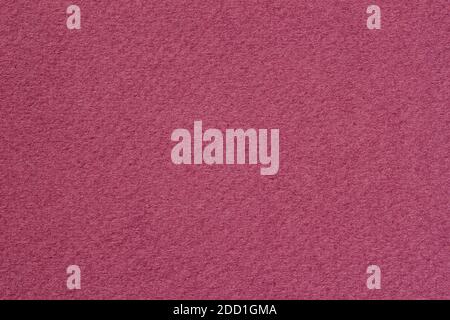 Texture of fluffy artistic paper close-up, burgundy color for wallpaper or banner design. Fashionable modern background, copy space Stock Photo