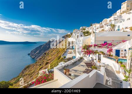 Summer vacation for travel destination flowers background. Wonderful scenery background, perfect holiday. Scenic view of traditional cycladic houses Stock Photo