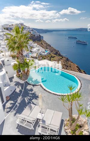 Luxury hotel resort and empty infinity swimming pool Santorini. Summer vacation travel destination romantic couple holiday. Sea caldera view landscape