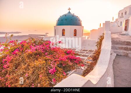 Amazing view with white houses, sunset on the famous Greek dome resort flowes Greece, Europe. Traveling background. Artistic summer landscape vacation Stock Photo