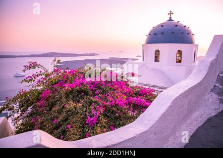 Amazing view with white houses, sunset on the famous Greek dome resort flowes Greece, Europe. Traveling background. Artistic summer landscape vacation Stock Photo