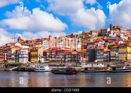 Douro river and local houses with orange roofs in Porto city aerial panoramic view. Porto is the second largest city in Portugal. Stock Photo