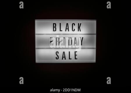 Black Friday Sale text on Illuminated lightbox in dark. Sales concept Stock Photo