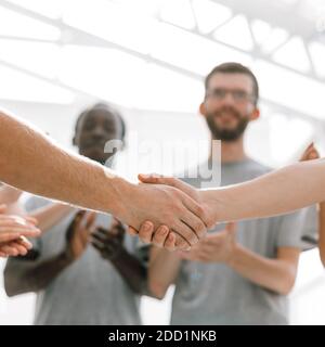 close up. handshake of two students on the background of the st Stock Photo