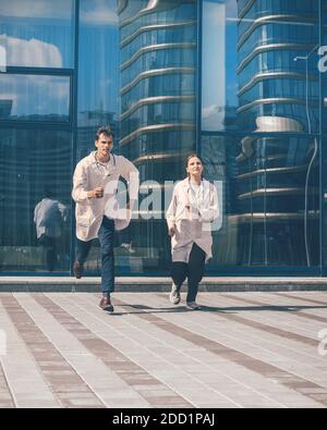 in full growth. medical professionals running to the rescue. Stock Photo