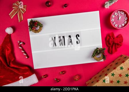 Xmas word on lightbox on Christmas decorated bacground Stock Photo