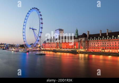 London Eye along the River Thames at sunset in London, England. Stock Photo