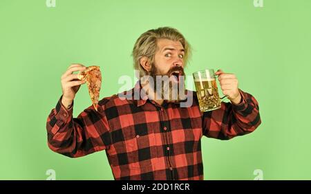 Best party here. bachelor men club. Having fun and drink in bar. nice pub menu. man watching football while drinking beer and eating pizza. eating pizza and drinking. take-away pizza. Stock Photo