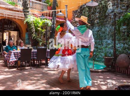 Caretagena, Colombia--April 21, 2018. Dancers in traditional garb perform a dance in a restaurant. Stock Photo