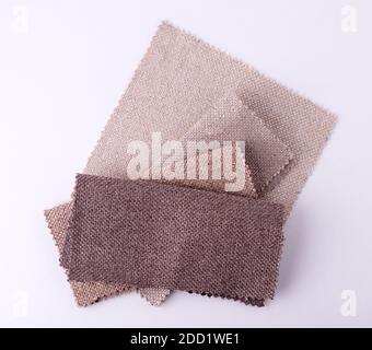 Light Set Sail Champagne and grey colors gunny textile samples. Fabric texture background Stock Photo
