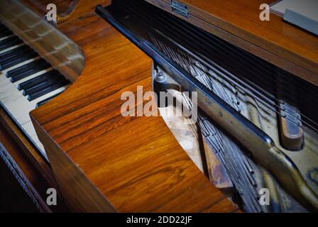 Old worn out piano close up of missing keys Stock Photo