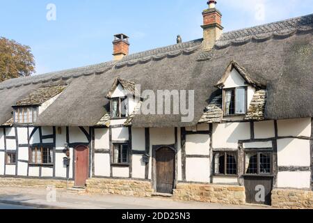 Thatched timber-framed cottages, High Street, Mickleton, Gloucestershire, England, United Kingdom Stock Photo