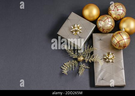 Handmade gift boxes festively wrapped, fortuna gold colored christmas balls and baubles. Care packaged handmade gifts, DIY concepts. Stock Photo