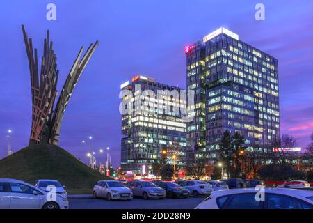 Bucharest, Romania - January 31, 2020 - Night scene in Piata Presei Libere (Free Press Square) in Bucharest, Romania, featuring the Wings Monument (Mo Stock Photo