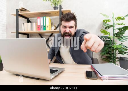 Business confrontation. Bad news. Failed again. Mission failed. It is your fault. So cruel. Brutal businessman in office. Mature man with beard. bearded hipster use computer. Male boss working. Stock Photo
