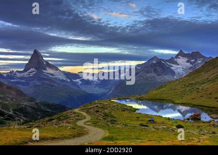 Before sunrise landscape with the famous Matterhorn (4478m ) and Lake Stellisee, just above Zermatt, Switzerland Stock Photo