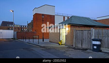 The north end of Woodlands Road meets the west end of Market Lane at Wickford, Essex UK.  Toilet block on the right. Stock Photo