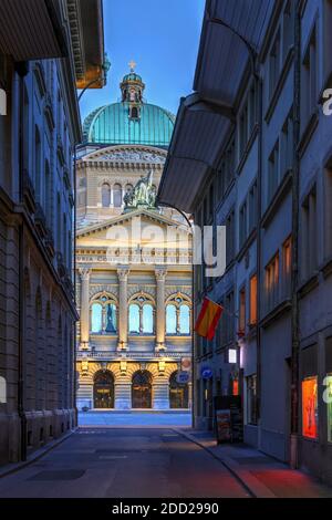 Vertical composition framed by a narrow alley of the Federal Palace (the seat of the Swiss Federal Assembly and the Federal Council) in Bern, Switzerl Stock Photo