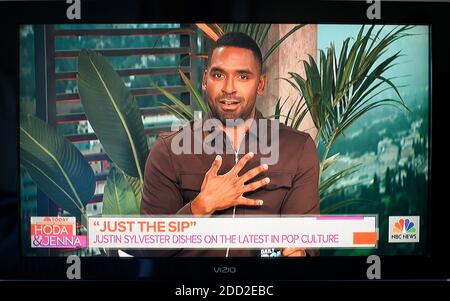 Television screenshot of 'E! Daily Pop' cable tv show host Justin Sylvester appearing as a guest on the NBC program, 'TODAY with HODA and Jenna.' Stock Photo