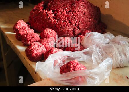 Piles of rounded ground meat ready for packaging Stock Photo