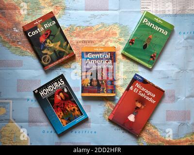 Selection of Central America travel guides and map of Central America from above Stock Photo