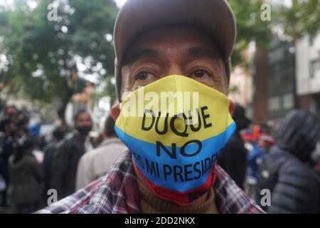 Bogota, Colombia. 23rd Nov, 2020. A man wears a mask that says ''Duque is not my president.'' In the protest against the murder of Dilan Cruz. Credit: Daniel Garzon Herazo/ZUMA Wire/Alamy Live News Stock Photo