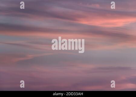 Cloud in the sky at sunset texture background. Pink, blue and gray abstract shades. True high resolution photography Stock Photo