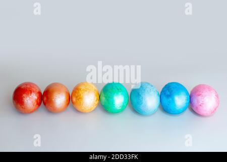 A row of rainbow colored Easter eggs Stock Photo