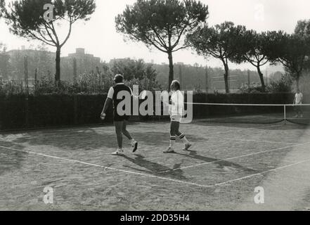 Italian sport journalist Giampiero Galeazzi playing tennis, 1980s Stock Photo