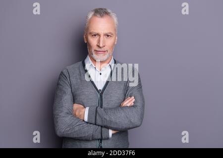 Portrait of his he nice-looking attractive candid content top manager financier business shark economist banker folded arms isolated over gray pastel Stock Photo