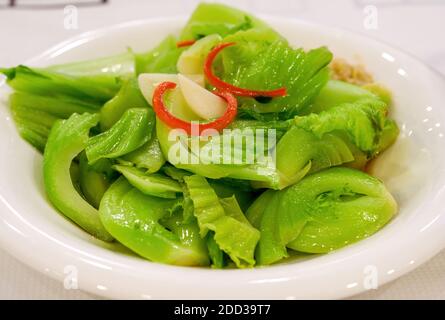 A Cantonese morning tea dim sum, boiled water mustard greens Stock Photo