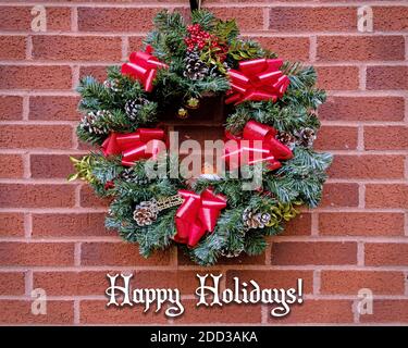 Christmas Wreath with red ribbons, pine cones and a robin, with Love ...