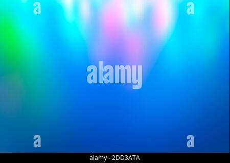 Iridescent holographic abstract bright neon colors background. Blurred colorful multicolored backdrop from lights Stock Photo