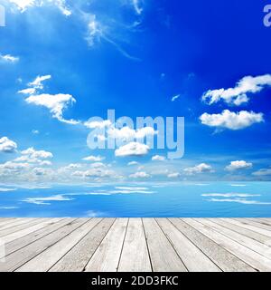 Wooden pier with blue sea and sky background Stock Photo
