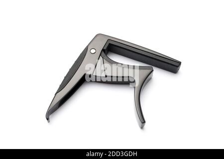 Black metal guitar capo isolated on white background Stock Photo