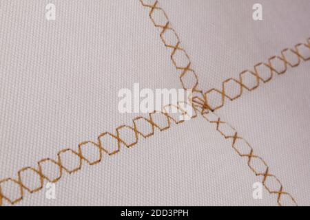 Machine stitch on leather fabric close up macro Stock Photo