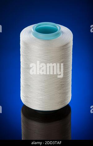 The cone of colored thread isolated on a white background Stock Photo ...
