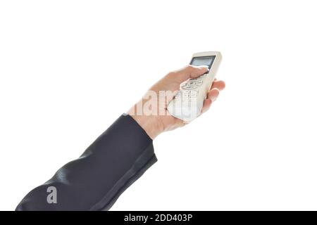 Business hand holding air conditioner remote, Isolated on white background. with clipping path. Stock Photo