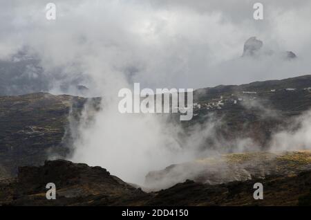 Village of El Toscon and Roque Bentaiga in the background. The Nublo Rural Park. Tejeda. Gran Canaria. Canary Islands. Spain. Stock Photo