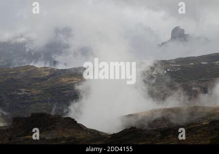 Village of El Toscon and Roque Bentaiga in the background. The Nublo Rural Park. Tejeda. Gran Canaria. Canary Islands. Spain. Stock Photo